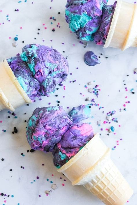 This galaxy ice cream is out of this world! Swirls of color, strawberry flavor, and tons of sprinkles that will put a smile on anyone's face. A no-churn galaxy ice cream recipe that is a must make. Mermaid Ice Cream, Galaxy Ice Cream, Rainbow Snacks, Black Ice Cream, Best Homemade Ice Cream, Easy Homemade Ice Cream, Unicorn Ice Cream, Ice Cream Containers, Making Homemade Ice Cream