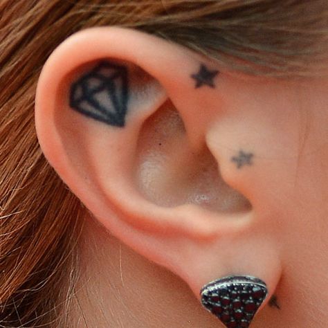 Cara Delevingne Diamond, Star Inside Ear Tattoo | Steal Her Style Ear Tattoo Moon, Tragus Tattoo, Cara Delevingne Tattoo, Toe Tattoo, Inner Ear Tattoo, Toe Tattoos, Tattoo Moon, Modern Hoop Earrings, Diamond Tattoos