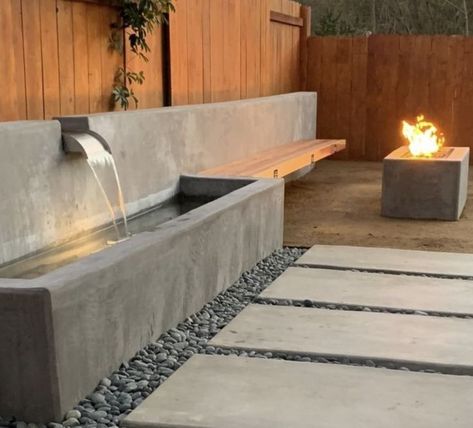 Modern Concrete Retaining Wall, Corner Water Feature, Backyard Water Feature Diy, Barn Landscaping, Concrete Sleeper Retaining Walls, Modern Water Feature, Water Feature Wall, Concrete Retaining Walls, Sloped Backyard