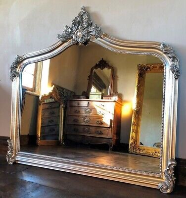 MirrorTraders.com This Mirror would make a lovely grand over-mantle mirror. The Annecy - Large Over Mantle - Antique Silver. Do not hang the mirror by picture wire of chain. Antique Gold. French Ivory / Cream. Beautifully hand finished in Antique Silver. Mirror On Fireplace Mantel, French Victorian Decor, Medieval Mirror, Silver Ornate Mirror, Arch Fireplace, Outdoor Mirrors, Art Nouveau Living Room, Mirror Over Fireplace, Mirror Above Fireplace