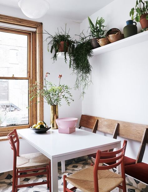 Too much colour can be overwhelming in a compact home. Thus balance is achieved with calmer areas decorated in whites or soft neutrals. Such is evident in the kitchen, where an array of pots and plants are the key decor items here. Ikea Melltorp Table, Melltorp Table, Ikea Melltorp, Hay Sofa, Colour Blocking Interior, Kitchen Seating, Italian Interior Design, Italian Interior, London Home