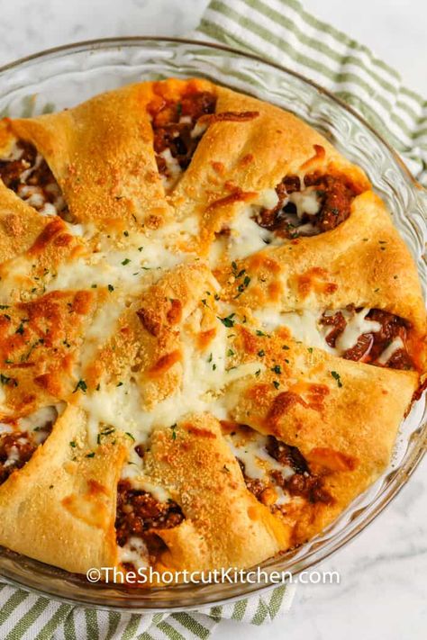 Easy Italian Casseroles with crescent rolls make perfect game day main dishes. With only 6 ingredients and just over 30 minutes, you can have this dinner ready in time for the half time show. #theshortcutkitchen #easyitaliancasserole #entree #recipe #zesty #pillsbury #simple #cheeseburgerpie #dinners #gameday Ground Italian Sausage Crescent Rolls, Crescent Rolls With Ground Beef, Pillsbury Crescent Dinner Recipes, Pillsbury Crescent Casserole Recipes, Meatballs And Crescent Rolls, Ground Beef And Pillsbury Crescent Rolls, Italian Cresent Roll Casserole, Crescent Rolls Ground Beef Recipes, Crescent Roll Recipes Italian