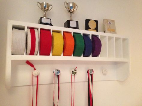 Martial Arts belt rack. Great storage & display for medals, belts & trophies. Kung fu, karate, judo etc. Made by RonJohn Home Improvements. Jiu Jitsu Belt Display, Martial Arts Belt Rack, Martial Arts Belt Holder, Brazilian Jiu Jitsu Belts, Taekwondo Belt Display, Karate Belt Display, Martial Arts Belt Display, Taekwondo Belts, Dojo Ideas