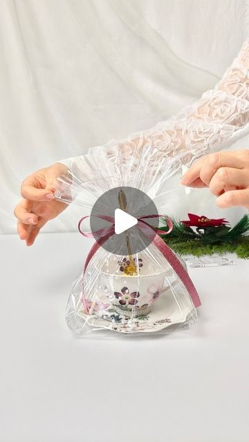 11K likes, 160 comments - raushan_willms on December 6, 2022: "How to wrap a gift in a non-standard form. For example, a cup with a saucer and a spoon. ☕🎁 Unbezahlte Werbung". Gift Wrapping Ideas For Cups, How To Wrap With Cellophane, How To Wrap A Plate As A Gift, Cup Gift Wrapping Ideas, How To Wrap A Bowl As A Gift, How To Wrap A Cup Gift, Wrapping With Cellophane, Food Gifts Wrapping, Wrap A Gift