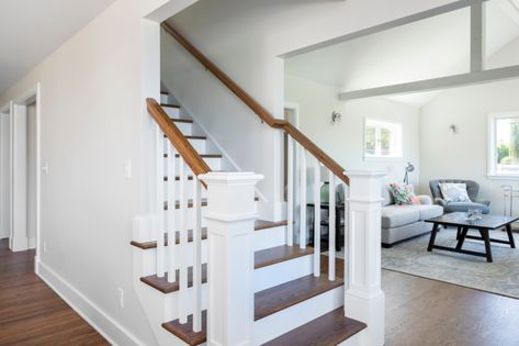 Stairway in First Floor Open-Concept & Remodel | Designed by Kirsten Dumo, Built by Model Remodel, Seattle, WA © Cindy Apple Photography Open Concept With Stairs In Middle Floor Plans, Open Concept Stairs In Middle, Center Staircase Open Floor Plan, Staircase Open On Both Sides, Closed In Staircase Ideas, Open Concept With Stairs In Middle, Open Stairs In Living Room, Open Staircase Ideas, Back Staircase