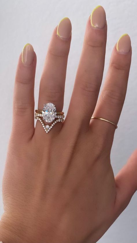 Glam oval engagement ring |engagement ring, ring, vintage ring, vintage engagement ring, diamond ring, diamond engagement ring, aqaumarine ring, engaged, engagement, bride to be, wedding, wedding proposal, proposal,wedding accessories, bridal jewelry, glam bridal sets, glam engagement rings,glam wedding,wedding proposal,dream wedding,bridal style,bridal stuff,bridal details,wedding planning,wedding ideas,winter wedding,winter wedding ideas,dream wedding ideas,wedding inspo V Shaped Wedding Band With Oval Engagement Ring, Oval Shape Wedding Band, Nesting Wedding Band Oval, Unique Oval Wedding Band, Wedding Band Around Oval Ring, Oval Engagement Ring With Chevron Wedding Band, V Ring Wedding Band, V Wedding Band With Engagement Ring, Oval Engagement Ring With Curved Band