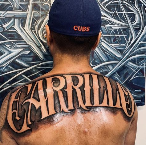 Last Name Tattoos On Back, Last Name Across Back Tattoo Men, Back Name Tattoo, Last Name On Back Tattoo, Tattoo Lettering Fonts For Men, Back Last Name Tattoo Men, Last Name Tattoos For Men On Back, Cool Name Tattoos, Chest Tattoo Men Lettering