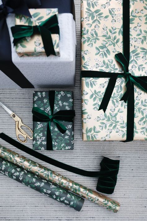 blogger hoang-kim cung shares how to wrap a gift with evergreen mistletoe wrapping sheets by rifle paper co, mistletoe gold wrapping sheets by rifle paper co, and oh christmas tree gift wrap by sugar paper + target Wrap A Gift, Gold Wrapping Paper, Buy Christmas Tree, How To Wrap, Sugar Paper, Christmas Favors, Nordstrom Anniversary Sale, Christmas Tree With Gifts, Velvet Ribbon