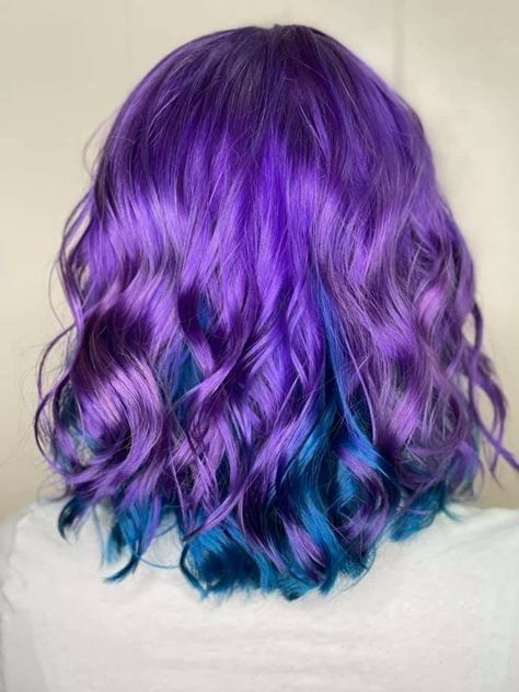 Blue purple short split-dye jewel hair color Split Dye Purple And Blue, Blue And Purple Hair Dye Ideas, Purple Multicolor Hair, Half Purple Half Blue Hair, Dark Blue And Purple Hair, Blue And Violet Hair, Jewel Tone Hair, Hair Split Dye, Purple Peekaboo Hair