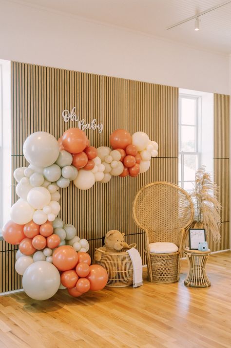 Experience the magic of a chic, modern baby shower with our stunning balloon arch in shades of coral and beige. Complimented perfectly by tastefully arranged wicker furniture, this setup creates an atmosphere of warmth and joy that soon-to-be parents will cherish forever. Gather with loved ones and create memories while celebrating your little one's arrival. Click to discover more unique baby shower decoration ideas. Oh Baby Shower Ideas, Unique Baby Shower Decorations, Baby Shower Decoration Ideas, Creative Baby Shower, Curated Decor, Elegant Interior Design, Baby Shower Decoration, Modern Baby Shower, Create Memories