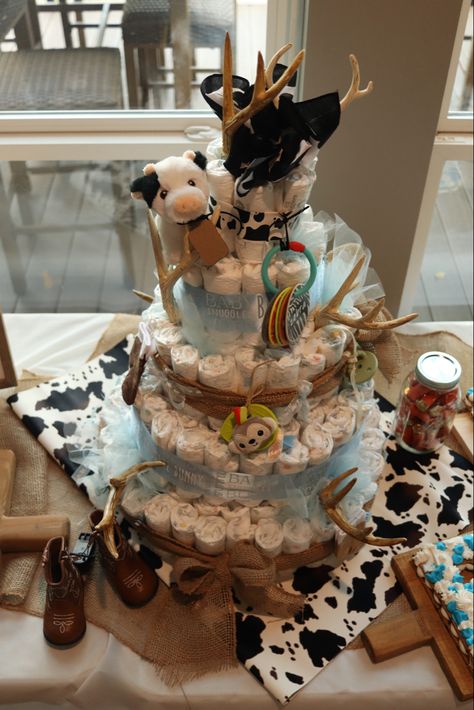 Diaper cake, baby shower, cake , baby boy, western newborn baby Cow Diaper Cake Baby Boy, Western Diaper Cake, Cow Diaper Cake, Cowboy Baby Shower Theme, Ash Baby, Baby Boy Cowboy, Unique Diaper Cakes, Cow Baby Showers, Farm Baby Shower