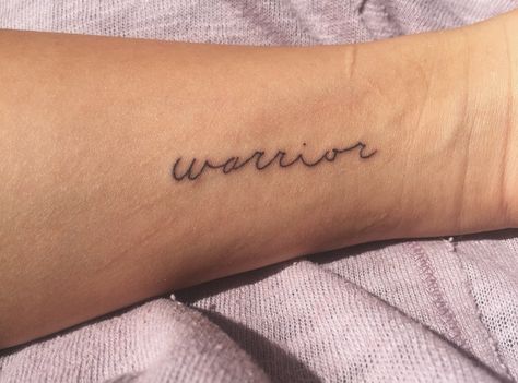 simple warrior tattoo Tattoos For Tough Women, Warrior Tattoos Simple, Simple Warrior Tattoo, Warrior Writing Tattoo, Warrior Text Tattoo, Worrier Tattoo Design, Side Foot Tattoos, Personal Tattoos, Fighter Tattoo