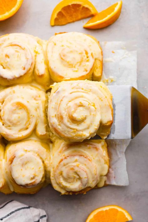 Sticky and soft with a vibrant orange flavor, these orange rolls are the best you’ll find. Simple to make, these are the zesty sister to a cinnamon roll! Rhodes Orange Rolls Recipe, Alabama Orange Rolls, Homemade Fluffy Pancakes, Orange Rolls Recipe, Cinnabon Cinnamon Roll Cake, Cinnamon Roll Pancakes Recipe, Orange Cinnamon Rolls, Orange Sweet Rolls, Cinnamon Roll Icing