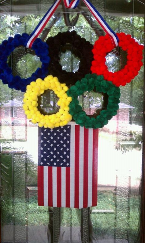 Olympic door wreath- small grapevines, colored poms and hot glue! Olympic Wreath, Blue Outdoor Decor, Patriotic Outdoor Decor, Winter Olympics Activities, Olympic Activities, Patriotic Porch Decor, Patriotic Tablescapes, Olympics Party, Olympic Idea