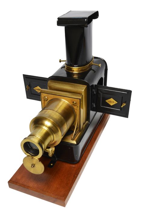 An antique magic lantern projector by William Charles Hughes of London.  Tinplate and brass, it was made for projecting glass lantern slides in the standard 3.25" format. Magic Lantern Projector, Magic Lantern, Glass Lantern, Antique Shops, Projector, Over The Years, Lanterns, Slides, Brass