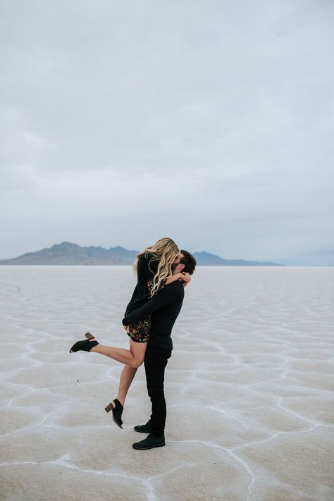 Couple in all black at the Bonneville Salt Flats engagement session professional Utah elopement photographer wedding photography playful adventurous engagements couple shoot engagement shoot outfit inspo #utahphotographer #engagements #EmilyJenkinsPhotography #elopement #photographer #saltflats #couple #couplesession Salt Flats Utah, Engagement Shoot Outfit, Best Places To Elope, Utah Elopement, Bonneville Salt Flats, Utah Mountains, Places To Elope, Salt Flats, Winter Photoshoot