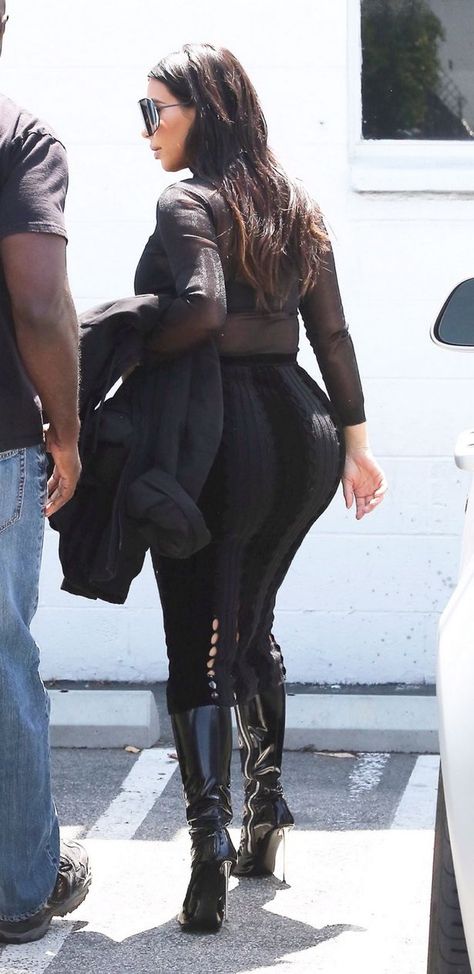 Kim Kardashian puts her curves on display in a tight black see through top and trouser outfit Bodycon Outfit, Tight Pencil Skirt, Kanye West Style, Sheer Outfit, Revealing Outfits, Kim Kardashian Outfits, Kardashian Outfit, Trouser Outfit, Kardashian Family