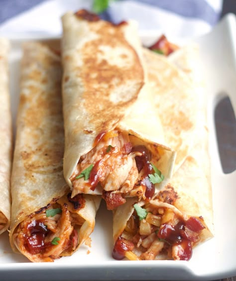 These Crispy BBQ Chicken & Bacon Wraps and simple, delicious and so quick to make.  Filled with chicken, cheese, bacon and BBQ sauce . . .a perfect weeknight meal. Crispy Bbq Chicken, Bacon Wraps, Bbq Chicken Wraps, Bacon Wrapped Chicken, Sandwiches And Wraps, Pudding Desserts, Chicken Wraps, Idee Pasto Sano, Chicken Bacon