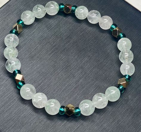 6mm Emerald Phantom Quartz Bracelet All bracelets come in a standard size of 7" in wrist circumference (with some stretch). Please message me with any questions or concerns if a different size is needed. A change in size may cause an increase in price. Please be aware that because these are natural gems small variations in sizes and colors occur. Girly Bracelets, Hand Beaded Bag, Making Bracelets With Beads, Intention Bracelets, Gems Bracelet, Phantom Quartz, Bracelets Handmade Beaded, Bead Bracelets, Quartz Bracelet