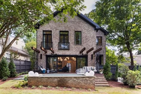 What a transformation! The backyard is a true escape from the daily grind, as well as the perfect spot for entertaining. The main element Hilary wanted to include was a saltwater plunge pool, and she got one with loads of style. A brick pool surround blends with the home's exterior, and the deck provides ample space for relaxing. Folding glass doors seamlessly meld the indoors with the outside. Old Brick House, Pine Hall Brick, House In America, Hilary Farr, Love It Or List It, Home Fits, Houses In America, Folding Glass Doors, Old Bricks