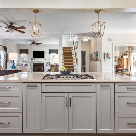 Cabinets- Double stack cabinets in 410F Linen by Waypoint Living Space with a 410F Painted Stone Island

Countertops- Diamond White Quartzite

Features: Cooktop in island, built in bench seat, double oven, warm accents

#greycabinets #kitchenisland #stackedcabinets #waypoint #whitecabinets
#greyisland #cooktop #faucet #benchseat Large Island With Cooktop And Seating, Large Kitchen Island With Cooktop, Kitchen Island With Cooktop And Seating, Stove In Island Kitchen, Kitchen Island Cooktop, Cooktop In Island, Stove In Island, Kitchen Island With Sink And Dishwasher, Kitchen Design Layout Island