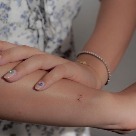 Tiny Outer Wrist Tattoo, Pet Initial Tattoo, Sibling Initial Tattoo, Dog Initial Tattoo, Kids Initial Tattoo, Kids Initials Tattoos For Women, Hidden Initial Tattoo, Tiny Initial Tattoo, Dainty Initial Tattoo