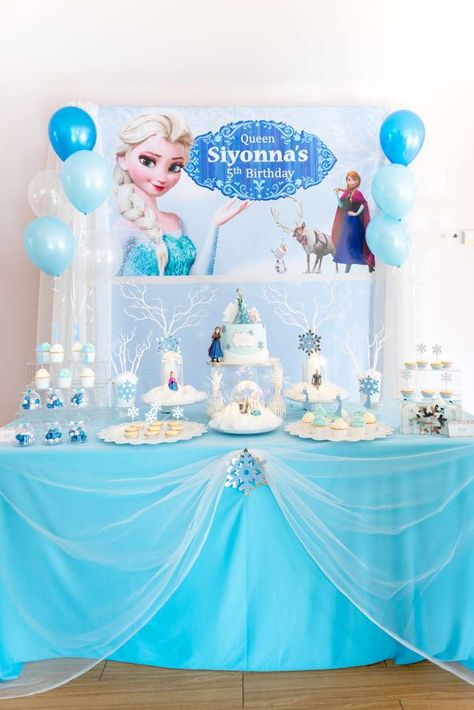 Take a look at this wonderful Frozen birthday party! The dessert table is so pretty! See more party ideas and share yours at CatchMyParty.com #catchmyparty #partyideas #frozenparty #princessparty #girlbirthdayparty #anna #elsa #frozen2 #frozen Elsa Backdrop, Frozen Dessert Table, Frozen Birthday Decorations, Frozen Birthday Party Cake, Frozen Birthday Party Decorations, Elsa Birthday Party, Frozen Bday Party, Frozen Party Decorations, Disney Frozen Birthday Party