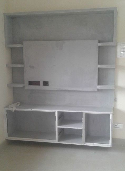 Cement TV Shelf Designs Wall Tv Unit Design Cement, Cobord Works Tv, Cement Tv Cupboards, Granite Tv Unit Design, Cobord Works, Tv Wall Design Cement Work, Tv Unit Design Modern With Cement, Tv Wall Design With Cement, Concrete Tv Unit