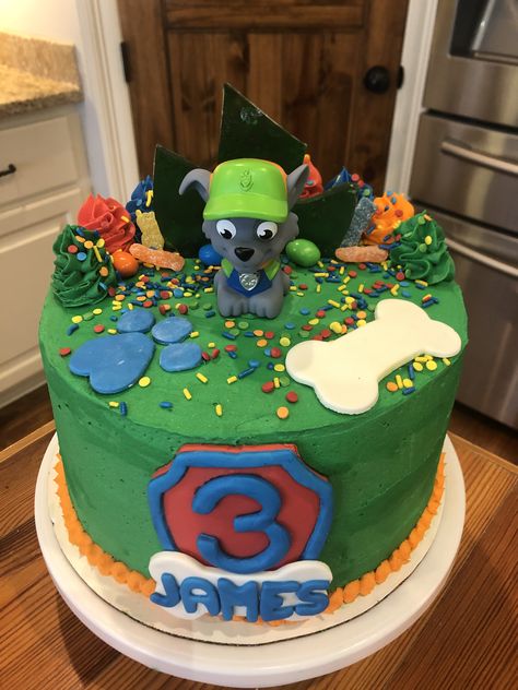 3 layer buttercream cake with custom fondant shield, bone and paw print. Topped with twist stars, candy and sprinkles. Paw Patrol Cake Rocky, Paw Patrol Rocky Cake, Paw Patrol Rocky, Paw Patrol Birthday Cake, 5 Birthday, Kids Themed Birthday Parties, Babies Room, Paw Patrol Cake, Patrol Party