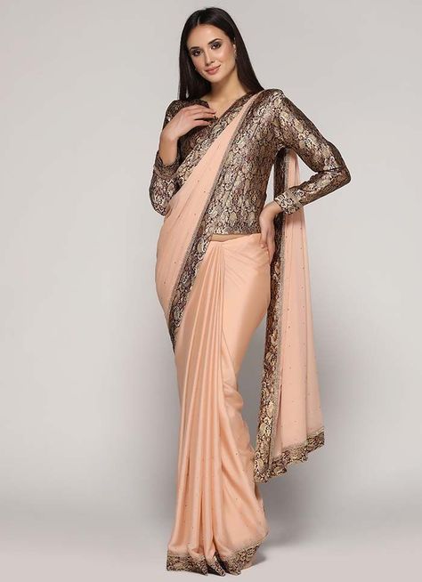 This peach georgette saree with brocade border features diamonte and continozircon stones studded along in neat patterns. It is paired with a contrasting brocade blouse with boat V-neckline and front opening. Peach Georgette Saree, Saree Readymade, Embellished Saree, Indian Clothing Brands, Long Blouse Designs, Ethnic Wear Indian, Brocade Blouse, Brocade Blouses, African Fashion Traditional