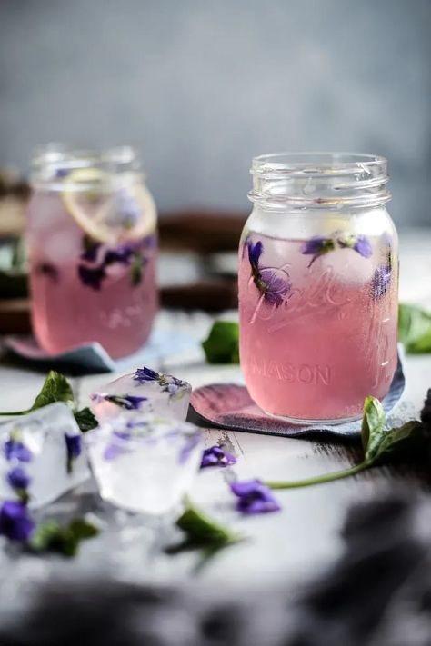 Celebrate Spring with this delightful color-changing violet syrup and lemonade made with foraged wild violets. | fareisle.com #violetsyrup #flowersyrup #edibleflowers #wildviolets #violetrecipes #wildvioletrecipes #foraging #foragingviolets #violetrecipe #foodphotography #foodstyling Violet Lemonade, Violet Syrup, Violet Recipes, Edible Flowers Cake, Wild Violets, Edible Flowers Recipes, Best Lemonade, Lemon Poppyseed Cake, Homemade Soda