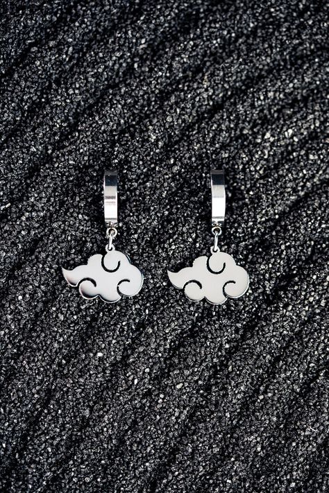 Initially used by Akatsuki as a symbol of justice and fairness, the symbol changed its meaning with the character of its members and their new values. The sign of justice and equality turned into the raining blood, this recognizable cloud is of violence and danger. Materials: Hypoallergenic Stainless Steel Earring dimensions: Approx. 1" by .75" (including earring hoop). Tomboy Jewelry, Symbol Of Justice, Akatsuki Cloud, Tomboy Haircut, Cloud Earrings, Earring Hoop, Unboxing Experience, Creative Packaging, Single Earring