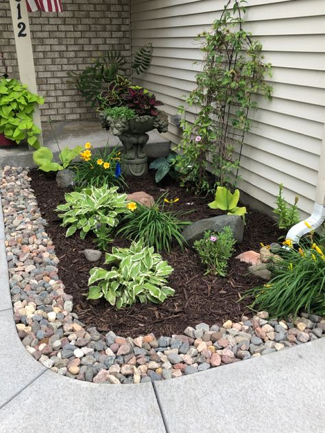 Potted Front Yard Landscaping, Boho Flower Beds In Front Of House, Landscaping With River Rocks Flower Beds, Flower Bed With Rocks, Using Rocks In Landscaping Flower Beds, Rock Flower Beds In Front Of House, Flower Garden With Rocks Instead Of Mulch, Stone Lined Flower Bed, Replace Flower Bed With Rocks