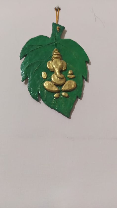 Ganesha on leaf# made with clay How To Make Ganesha With Clay, Dipawali Decoration, Diy Ganesha, Leaf Ganesha, Ceramic Mural, Ganesha Murti, Clay Ganesha, Recycled Paper Crafts, Mirror Crafts