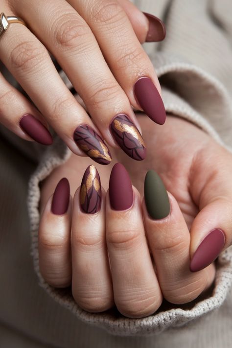 Embrace the cozy spirit of autumn with these stunning matte fall nail ideas that bring a touch of elegance to your look. Picture deep burgundy and rustic orange shades, perfectly muted for a sophisticated finish. These nails not only celebrate the changing season but also add a trendy twist to your style. Get ready to flaunt your fall vibes and inspire others with this chic matte design! Vintage Fall Nails, Burgundy Fall Nails Designs, Autumn Nails Matte, Fall Matte Nails Autumn, Maroon Fall Nails, Matte Burgundy Nails, Fall Matte Nails, Fall Nails Matte, Burgundy Matte Nails