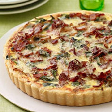 1 piecrust 4 slices bacon, cut crosswise into ¼-inch slices 6 cups baby spinach 1½ pounds yellow onions (about 4), halved and cut crosswise into ¼-inch slices (6 cups) ¾ teaspoon salt ¼ teaspoon dr… Spinach Tart, Recipes Spinach, Bawang Bombay, Spinach Quiche, Savory Tart, Think Food, Quiche Recipes, Bacon Recipes, Bacon Cheese