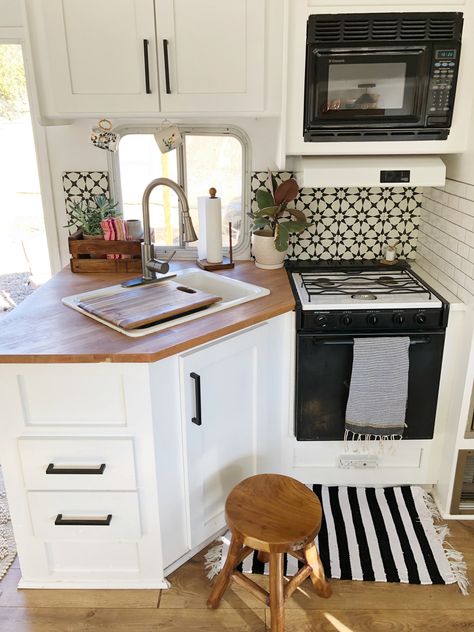 The black and white tiles are from the Cement Tile Shop. The butcher block countertop is from IKEA. Ikea Tiny Kitchen, Camper Vintage, Kitchen Remodel Countertops, Kitchen Countertop Materials, Rv Makeover, Bus Life, Interior Remodel, Rv Decor, Black And White Tiles