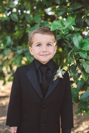 such a dapper dude in black on black, and just look at those big blue eyes! Ring Bearer Outfit Black, All Black Tux, Ring Bearer Suit, Santa Paula, Bearer Outfit, Big Blue Eyes, Ring Bearer Outfit, Dark Wedding, Wonderland Wedding