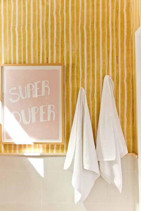 Small Bathroom Funky Wallpaper, Playful Bathroom Ideas, Removable Wallpaper For Renters Bathroom, Guest Bathroom Rental, Small Bathroom Redo On A Budget, Bright Guest Bathroom, Yellow Half Bath, Retro Wallpaper Bathroom, Playful Bathroom Design