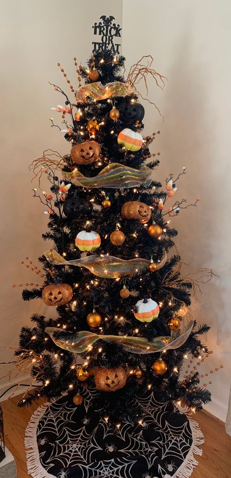 Ornament items include... 1 Tree Topper (Trick or Treat toppers are currently sold out. This tree topper would be replaced with a Bat topper, please see picture) 3 Candy corn mesh garland  6 orange Pom poms  6 orange sprays  6 candy corn sprays  7 Candy Corn pumpkins 8 Orange and Black light up Jack-O-Lanterns  25 assorted ornaments Witch Tree Halloween, Candy Corn Christmas Tree, Halloween Themed Christmas Tree, Halloween Tree Topper Ideas, Black Halloween Tree Decorating Ideas, Fall Ornaments For Tree, Candy Corn Tree, Diy Halloween Trees Ideas, Halloween Tree Decorations Outdoor