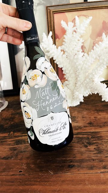 Diy Handpainted Wine Bottles, Engagement Painted Bottle, Painted Wine Bottles For Wedding, Black And White Painted Champagne Bottle, Champagne Bottle Painting Wedding, Hand Painted Champagne Bottle Engagement, Painted Wedding Bottle, Decorative Wine Bottles Diy, Hand Painted Champagne Bottle Wedding