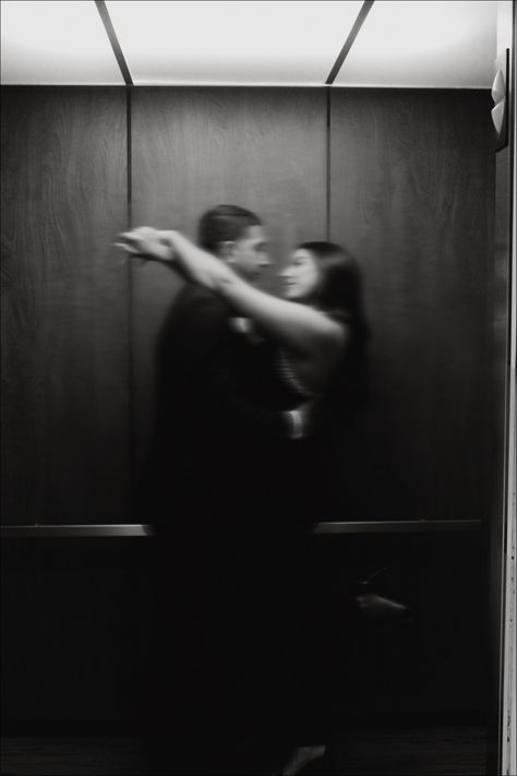 Black and white blurry photo of a couple in an elevator, the girls arms are over the shoulders of the boys Wedding Studio Photography Ideas, Elevator Couple Photos, Couple In Elevator, Elevator Couple, Elevator Kiss, Elevator Photography, Museum Shoot, Elevator Photoshoot, Couple Poses Engagement