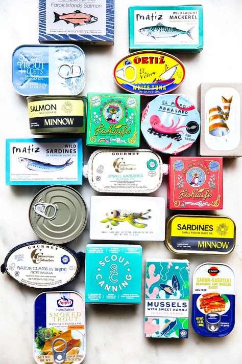 Tinned fish: It’s not a trend—it’s a lifestyle. Tin Fish Pairings, Canned Fish Board, Canned Fish Charcuterie, Tin Fish Packaging, Tinned Fish Charcuterie Board, Fishwife Tinned Fish, Tinned Fish Art, Tin Fish Art, Tinned Fish Aesthetic