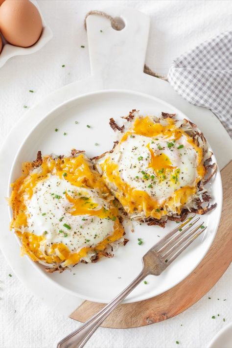 These fried eggs in crispy potato nests with cheddar cheese are the ultimate breakfast or brunch! They're high protein, easy to make and so delicious. Potato Nests, Egg And Potato, Posting On Instagram, Shredded Potatoes, Egg Nest, Cream Kitchen, Ultimate Breakfast, Breakfast Potatoes, Fried Eggs