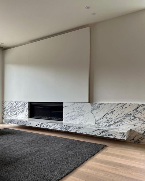 untitled [design agency] on Instagram: "shifting planes — concealed media wall above an arabescato fireplace hearth . . . . #untitleddesignagency . #interiordesign…" Concealed Tv Above Fireplace, Modern Cast Stone Fireplace Surround, Concealed Tv Unit, Arabescato Fireplace, Fireplace And Tv Wall, Concealed Tv, Cast Stone Fireplace Surround, Fireplace Bookcase, Tv Above Fireplace