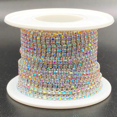 PRICES MAY VARY. ▲ Towenm Rhinestone Chain Roll: 10 Yards 1 Roll. Size: SS6(2mm); Color: Silver Base+AB Rhinestones ▲ Towenm Rhinestone Close Chain are all linked by a mesh grid, which can easily be cut with scissors, you can cut it to the length that you want, to sew on or glue, to fulfill your craft DIY decorations(glue is not included). ▲ Towenm Crystal Rhinestone Close Cup Chain are made of brass clasp and glass rhinestone, NOT Acrylic. Can be used to DIY Fashion Jewellery, or make some deco Peach Cosplay, Anastasia Musical, Bridal Trim, Rhinestone Cups, Rhinestone Material, Ribbon Wrap, Rhinestone Chain, Rhinestone Trim, Wedding Fabric