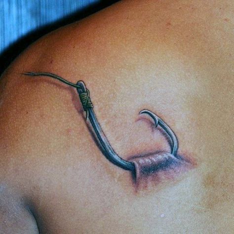 Man With Back Tattoo Of Fish Hook Catching On Skin Men Fish Tattoo, Hook Tattoos For Men, Fish Hook Tattoo For Men, Fisherman Tattoo, Fly Fishing Tattoo, Fishing Tattoos, Hook Tattoo, Fishing Hook Tattoo, Hook Tattoos