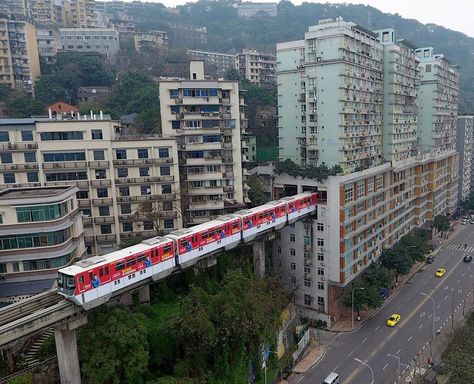 Chongquing, China - where you don't go to catch the train...the train comes to catch you. China Train, Chongqing China, Block Of Flats, Mountain City, Train Route, U Bahn, Chongqing, Futuristic City, Weird Pictures