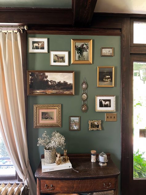 Green Wall Gallery Ideas, Photo Wall Interior Design, Green Walls Gold Frames, Green Wall With Gold Frames, Good Frame Gallery Wall, Gallery Wall With Photos, Dark Green Wall With Gold Frames, Earthy Gallery Wall, Gallery Wall On Wallpaper