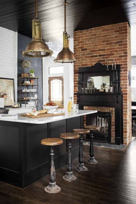 black cabinets with exposed brick wall kitchen - Trendir Industrial Decor Kitchen, Industrial Kitchen Design, Black Kitchen Cabinets, Primitive Kitchen, Industrial Kitchen, Black Kitchen, Black Cabinets, Painted Ceiling, Luxury Kitchens